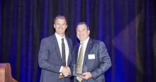 Ilekis accepting Cornerstone Award from Mayor Robert Barnett